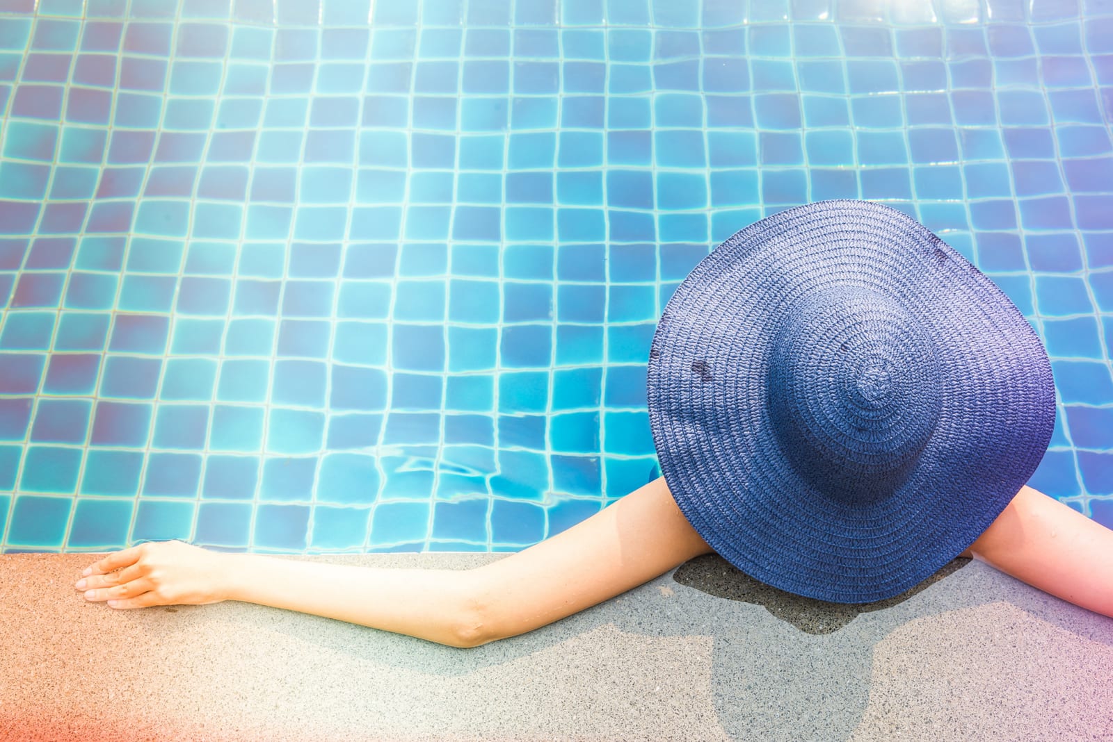 Swimmer in a clear blue residential pool