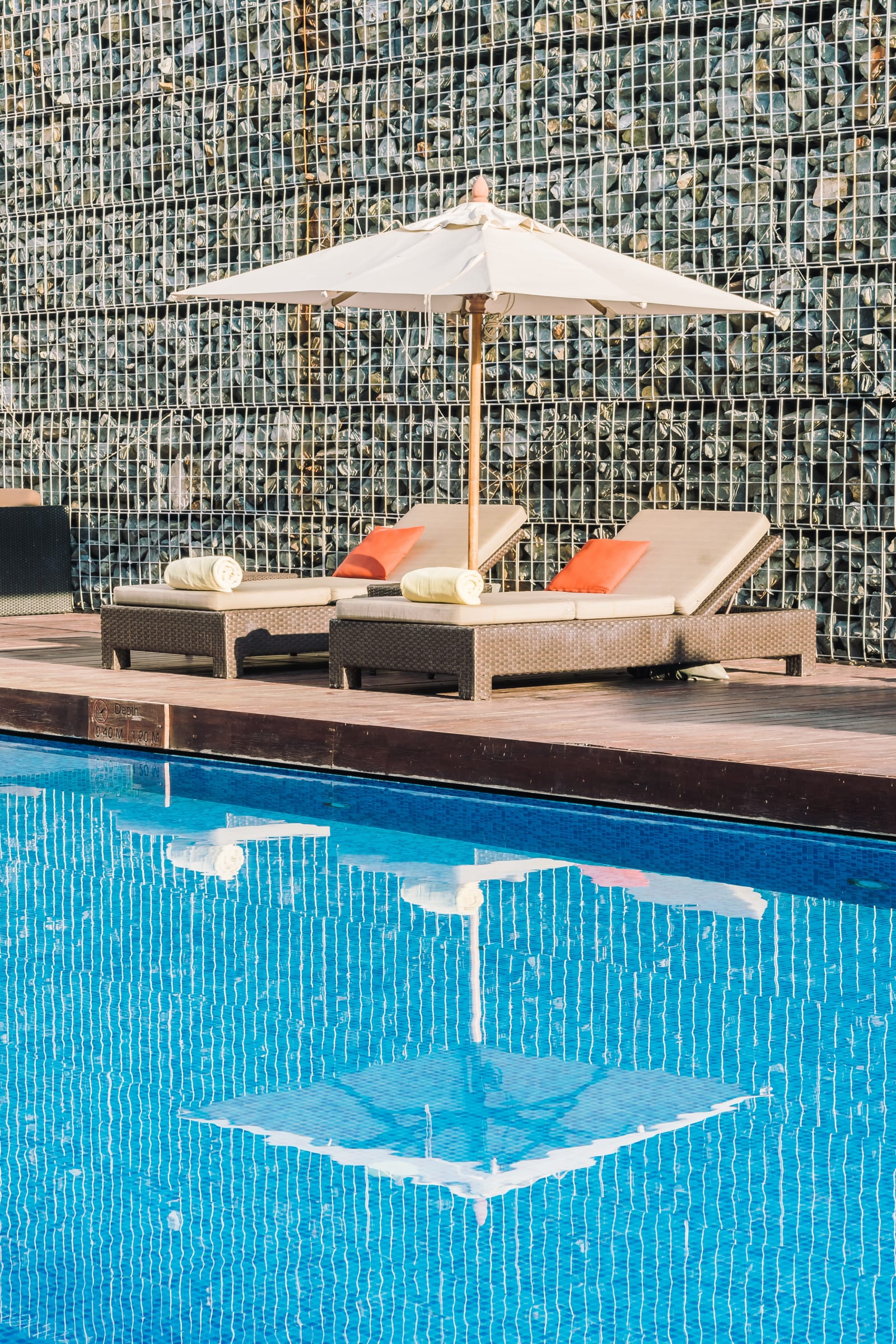 Resort-style pool deck with wide stone stairs